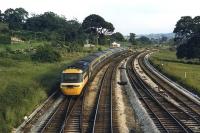 Summer evening at Aller Junction as a HST takes the Paignton line passing the mechanical signalbox and the Plymouth line curving away to climb Dainton bank. The junction has since been removed and now the two railways run parralel to Newton Abbott before converging. <br><br>[Mark Bartlett /07/1986]