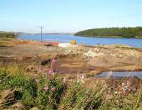 Works area along the Airdrie-Bathgate route near Forrestfield on 11 September. View is west over Hillend reservoir with the trackbed skirting the south shore and the houses of Caldercruix standing in the middle  distance.<br>
<br><br>[John Furnevel 11/09/2009]