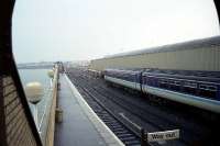 It is early morning and very wet in this view south from the top of the steps on the covered footbridge looking along the external platform at Stranraer Harbour on 28 April 1990. <br><br>[John McIntyre 28/04/1990]