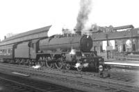 Looking across the tracks at Kilmarnock in August 1962 as Stanier <I>Jubilee</I> class 4-6-0 no 45734 <I>Meteor</I> restarts the 2pm Glasgow St Enoch - Dumfries train.<br>
<br><br>[Colin Miller /08/1962]