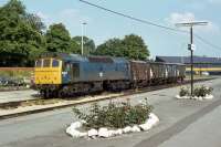 At rest at Aylesbury in July 1978 is 25 205 with a short Express Parcels train. The brightly coloured stock in the background is the <I>Safety Train</I>, a rake of exhibition carriages that toured the country at the time promoting safety on the railways.<br><br>[Mark Dufton 10/07/1978]