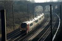 A northbound Voyager on the Down Fast line approaches Preston on 6 January 2009. In the background is Bee Lane bridge and beyond it can be seen Farington Curve Junction under the central arch on the Slow lines. To the right at this junction are the lines to Ormskirk and East Lancashire. The photograph has been taken from Skew Bridge in Penwortham.<br><br>[John McIntyre 06/01/2009]