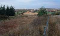 Looking to Mouldron Junction from the former branch which ran to Levenseat Quarry and Mouldron Colliery. In the distance the line runs off to Fauldhouse station.<br><br>[Ewan Crawford 06/12/2003]