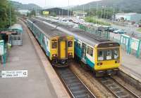 South Wales Valley services passing at Taffs Well with 150236 bound for Aberdare and 142076 leading a Pacer 142/143 combination heading into Cardiff Central. Because three valley lines converge above Taffs Well it enjoys a six trains an hour service in each direction during the day. <br><br>[Mark Bartlett 18/09/2009]