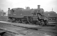 BR Standard 2-6-2T no 84019 on shed at Bolton MPD in September 1958. The former L&YR depot, located alongside Crescent Road, closed at the end of June 1968, at which time it carried shed code 9K and was one of the last BR operational steam sheds. The buildings had been demolished and the site cleared by 1973. A housing estate now stands here, the main street of which is named <I>The Sheddings.</I><br><br>[Robin Barbour Collection (Courtesy Bruce McCartney) 30/09/1958]