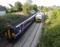 156 462 leaving Dunlop with 16.04 to Glasgow Central on 17 September passing a pair of track machines just beyond the station. <br><br>[Ken Browne 17/09/2009]