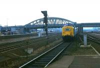 Deltic 55007 <I>Pinza</I> clears Thorpe Road Bridge as it approaches Peterborough station on 24 April 1979 with a northbound train on the East Coast Main Line.<br><br>[Peter Todd 24/04/1979]