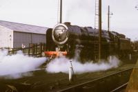 A 'last weekend of steam' photograph showing the last Britannia 4-6-2, 70013 <I>Oliver Cromwell</I> ready to leave 10D Lostock Hall shed for specials duties. In the background are the platforms of the original Lostock Hall station, which closed the following year. <br><br>[David Hindle 02/08/1968]
