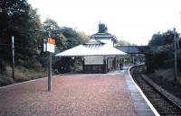 Maxwell Park is probably one of the classiest suburbs south of the Clyde, and as the train leaves Glasgow it's interesting to try and spot who's going to alight there, even among the fairly comfortable-looking patrons characteristic of this line (I'm drawing no further comparisons). When this photograph was taken in October 1987 other stations on the western side of the Cathcart Circle still had original buildings, but now Maxwell Park remains the only one with any building (discounting shelters). It has been smartened up, has <I>heritage</I> lighting and looks fine, despite being unstaffed [see image 20318].<br>
<br><br>[David Panton /10/1987]