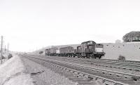 A Clayton north of Dalry with a down goods in 1967. The small vans might possibly be gunpowder vans bound for Ardeer with a barrier wagon marshalled immediately behind the locomotive.<br>
<br><br>[Colin Miller //1967]