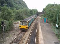 A Barry Island service leaves Taffs Well towards Radyr from where it will take the Cathays line into Cardiff. 143606 is trailing 142076 as the service heads south. <br><br>[Mark Bartlett 18/09/2009]