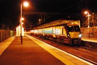 334029 waits at Milngavie in the evening. The driver takes a rest in the small building on the left. A third platform existed until the mid 1980s on the left.<br><br>[Ewan Crawford 26/09/2009]