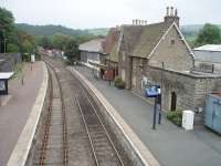 At the time of this photo Knighton's passing loop was out of action  and a sign proclaimed that all trains (4 each way a day) departed from Platform 1. New electrically operated points were later installed and the loop is now fully operational again with both platforms in use. View towards Craven Arms from the station footbridge.<br><br>[Mark Bartlett 19/09/2009]