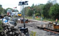 Looking south at the re-doubling works by Lugton box. The track here was double but is being re-laid as part of the works. Just before taking the photograph a rail mounted crane retreated and the tamper went slowly over the line.<br><br>[Ewan Crawford 26/09/2009]