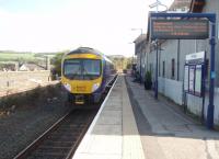 Climbing to make its Oxenholme connection with the WCML, which follows the line of trees below the left skyline,  185103 leaves Kendal. The former station building on the right has been converted into apartments and passenger accommodation is now a small modern shelter behind the camera.<br><br>[Mark Bartlett 26/09/2009]