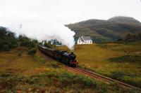 A picture I have always wanted to take.K1 62005 carrying the nameplates <I>Lord of the Isles</I> brings <I>The West Highlander</I> up the gradient past the disused <I>Our Lady of the Braes</I> Catholic Church near Lochailort.Made famous in the film <I>Local Hero</I> it may be converted to a private home.<br><br>[John Gray 26/09/2009]