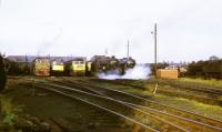 A view of Lostock Hall at the end of steam working. All the steam locos visible are LMS 5MT 4-6-0s, those on the far right being on the scrap line. Two Class 25 Type 2 and a Brush Class 47 are also visible as is one of the four Yorkshire Engine Co 0-4-0DH Class 02 shunters (D2861/2/3/8) that replaced the Kitson LMS 0F 0-4-0STs [see image 31189] on local shunting duties and worked from here until 1970. <br><br>[David Hindle 02/08/1968]