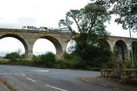 Tamper paused on the viaduct south of Stewarton. The view looks east.<br><br>[Ewan Crawford 26/09/2009]