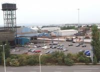 Early morning steelworks scene as hired DBS shunter 08782 <I>Castleton Works</I>, a long way from its previous work location, arrives to collect some loaded steel wagons from inside the blue shed. This is the view from the Future Inn hotel in Cardiff Bay and while Mrs. B. would have preferred to look at the harbour I was quite happy with this busy scene and the numerous trip workings!<br><br>[Mark Bartlett 19/09/2009]