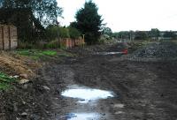 Looking east at Plains station. The old platform has gone. You may be pleased to learn that that is not an orange clad figure drowning in a watery bog in the mid distance.<br><br>[Ewan Crawford 26/09/2009]