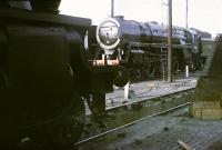 70013 <I>Oliver Cromwell</I>, the last surviving Britannia Pacific, is prepared on Lostock Hall shed on 2 August 1968 for one of the final 'End of Steam' specials as a Black 5 simmers on an adjacent road. Forty years later the loco is of course back on the main line once again. <br><br>[David Hindle 02/08/1968]
