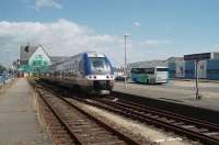 One of the stylish new SNCF DMUs, a four car set on this occasion, waits at the seaside terminus of St. Gilles Croix de Vie, before returning to Nantes. Although there are only a limited number of trains serving the branch the station is fully staffed and the building was undergoing refurbishment at the time of this visit.<br><br>[Mark Bartlett 19/06/2009]