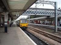 A stopping service for Leeds, comprising Pacer 144002, calls at Platform 2 at Wakefield Westgate. The surviving through road is bi-directional and there is a turnback siding just beyond this platform so this busy station has a flexible track layout. View towards Leeds.<br><br>[Mark Bartlett 04/09/2009]