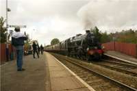 Spitfire Railtours special on the route of the former Cotton Mills Express is seen in the passing loop at Darwen station on the Blackburn to Bolton leg of the journey on 03 October 2009. The driver of 45231 had been trying to keep the train moving but the northbound service failed to clear the single line section from Bromley Cross before he reached the section signal. The result was that the Black 5 had to restart the 9 coach train on the 1 in 64 climb south from Darwen which in just over a mile reaches Sough Tunnel and continues the climb through the 1 mile 255 yard structure. Not a place for novice drivers!<br><br>[John McIntyre 03/10/2009]