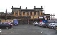 The listed 1847 Edinburgh & Northern Railway building at Burntisland has been looking a bit shabby since it was vacated by its last tenant, the Forth Ports Authority, in 2001.There has been a small fire since that time.Fortunately, Scottish Government funding is now enabling Historic Scotland to renovate the old building for business and community use.Work can be seen in progress on 30 September in a photograph taken from Forth Place. The 1890 Burntisland station remains unaffected. <br>
<br><br>[David Panton 30/09/2009]