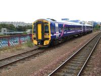 158727 travels towards Ferryhill on an ecs movement on 25 September, bypassing a 13 coach charter train waiting for a platform at Aberdeen. The Wellington Suspension bridge over the River Dee can be seen on the left.<br>
<br><br>[B A Cairns 25/09/2009]