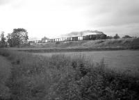 A <I>Clan</I> Pacific at speed with a southbound Aberdeen - Kings Cross fish train in the early 1960s, photographed shortly after passing through Beattock station.<br><br>[A Snapper (Courtesy Bruce McCartney) //]