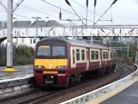 Arriving at platform 2 of Helensburgh Central on 21 September 2009 is 320 305 with a service from the far east (Drumgelloch).<br><br>[David Panton 21/09/2009]