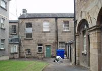 The rear of Lancaster Greaves station building and probably the point where the tracks from Preston would have terminated. Former stable block still standing to the right but modern hospital buildings occupying much of the old track area. Because the railway was only here for a short period in the 1840s information is limited but the current occupiers of the building would be interested in any information about its history. Photo by kind permission of Morecambe Bay Hospital Trust Estates Department.<br><br>[Mark Bartlett 25/09/2009]