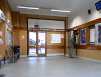 'To Edinburgh & Glasgow' announces the 1960s block-serif lettering above the door to Platform 1 at Burntisland on 30 September. Edinburgh has always been the main destination, although several services a day from the east coast did run direct to Glasgow via the Forth Bridge and the Dalmeny to Winchburgh line. That stopped in 1970, not to be reinstated until 1996 when a sole daily return service was introduced between Kirkcaldy and Glasgow (and still runs). For 26 years however that 'Glasgow' remained as if imminent reintroduction were expected. <br>
<br><br>[David Panton 30/09/2009]