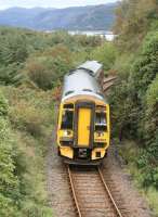 The 1101 Inverness - Kyle of Lochalsh leaves the south shore of Loch Carron on 29 September as it slows for the stop at Plockton. <br>
<br><br>[John Furnevel 29/09/2009]