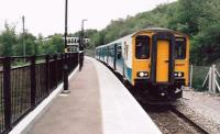 When I lived in Wales, it was all growling 37's and 0-8-0 diesel shunters here. So a squeaky clean 150 looks a bit out of place. But it was encouraging to see the service well patronized, even on a Bank Holiday Monday - and even feeding into Cardiff.<br><br>[Ken Strachan 25/05/2009]