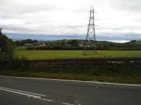 Infilled former route of Mold to Wrexham line which curved round to centre right heading into Brymbo, viewed from B5102 Minera Road over-bridge to west of Brymbo. A deep, heavily overgrown, cutting still exists on Mold side of bridge. <br><br>[David Pesterfield 22/09/2009]