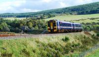 An Inverness bound train approaches Orton from the east. With the slight uphill trains really move quickly here, one moment it was on the viaduct then it was by me. The photograph is taken from the trackbed of the original alignment of the Morayshire Railway line to Craigellachie (later renamed Dandaleith when it ceased to be a terminus). The section between Orton and Rothes was abandoned when a new route was opened from Rothes to Elgin. Despite being closed in 1866 the trackbed of the abandoned route is in remarkably good shape in places.<br><br>[Ewan Crawford 30/09/2009]