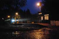 In torrential rain a train for Kyle slows at Achnashellach but does not stop as there were no passengers waiting. Achnashellach is a request halt.<br><br>[Ewan Crawford 28/09/2009]