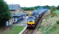 The empty coaching stock of the <i>Royal Scotsman</i> absolutely hammers through Fearn. The passengers had alighted at Tain and the coaches went to Inverness for servicing. This was the train returning to Tain to pick up the passengers.<br><br>[Ewan Crawford 29/09/2009]