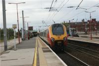 A Birmingham New Street to Glasgow Central calls at Wigan North Western on the afternoon of 15 October 2009. The view looks northwards.<br><br>[John McIntyre 15/10/2009]