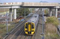 View east towards Edinburgh Park station on 13 October with 158 732 passing below the newly installed tramway bridge and overhead wires.<br><br>[Bill Roberton 13/10/2009]