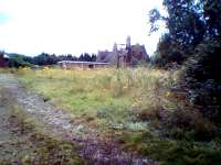 A bit of a fuzzy shot from a cheap digital camera, but there's nothing left now (notice the signs of arson on the roof, and the tacky modern extension). The LNW station is also demolished.<br><br>[Ken Strachan 03/08/2008]