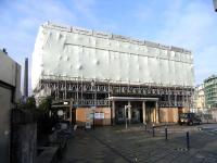 Perhaps taking advantage of the fact that the Haymarket area is a building site (and has been for what seems like decades) the 1842 Haymarket station building is having another facelift. Open scaffolding now seems increasingly to be a thing of the past with today's sites looking as if they are hermetically sealed. This surely improves the workers' conditions and has the bonus of relegating unseemly sexist behaviour to another age. Photographed on 10 October 2009.<br>
<br><br>[David Panton 10/10/2009]