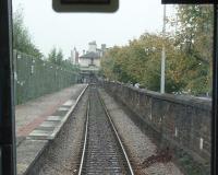 The approach to Cardiff Bay, as seen through the slightly grubby front window of ATW <I>Bubble Car</I> 121032 on another of the five times an hour shuttles from Queen St. The original station building is just beyond the buffer stops at the end of what is now a one mile siding.<br><br>[Mark Bartlett 18/09/2009]