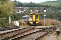 The lines to the Far North and Kyle of Lochalsh split to go their separate ways half a mile north of Dingwall station. The photograph, taken from one of the two foot crossings on an overcast 1 October 2009, shows 158720, forming the 1203 service from Kyle, slowly approaching the junction to join the route from Wick and Thurso as it turns south towards Inverness.  <br>
<br><br>[John Furnevel 01/10/2009]