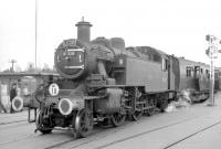 Ivatt 2MT no 41320 (with 80151 at the rear) takes over the LCGB Hampshire Branch Lines Railtour at Lymington Pier station on 9 April 1967. The train will shortly depart on the next leg of the tour to Brockenhurst.<br><br>[Robin Barbour Collection (Courtesy Bruce McCartney) 09/04/1967]