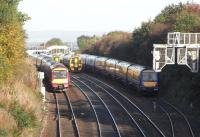 The Forth Bridge lines are carrying at least 7 passenger services an <br>
hour each way, so when the loops at Dalmeny are used for reversing <br>
trains during occasional diversions of Edinburgh - Glasgow services <br>
things can get busy, even with the interloper service reduced to <br>
half-hourly. Four abreast here on 17 October are, left to right: in the Down Loop a service from Edinburgh waiting for access to the Winchburgh Junction line for Glasgow; an unidentified train bound for the Forth Bridge; a local which has just left Dalmeny station (in background); in the Up Loop a service from Glasgow during a long wait to access the Edinburgh line. <br>
<br><br>[David Panton 17/10/2009]