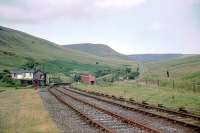 Torpantau was the highest point of the Brecon & Merthyr and at the entrance to the highest tunnel in the UK (I think). This picture was taken in 1964 after closure and looks north. [See image 25884.]<br><br>[John Thorn //1964]