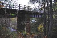 Between Knockando and Blacksboat there are several bridges over burns. The largest span is over the Allt Adhair Burn wich is spanned by this viaduct. A substantial structure it is now part of the Speyside Way. In the background beneath the piers the River Spey can be seen.<br><br>[John Gray 21/10/2009]